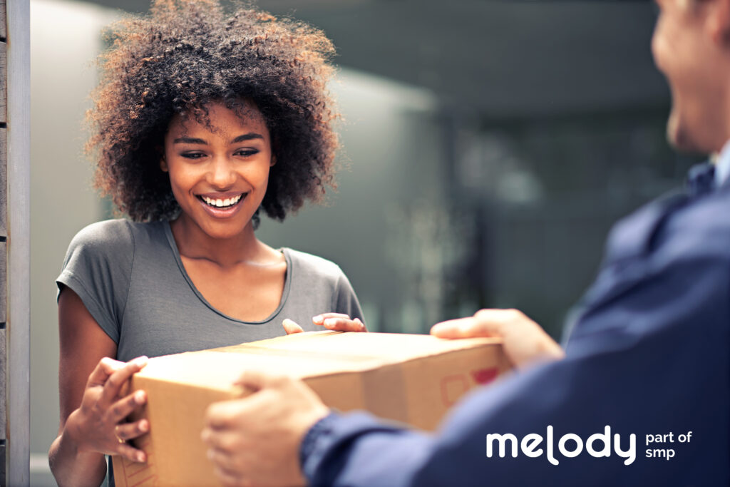 woman accepting parcel from courier