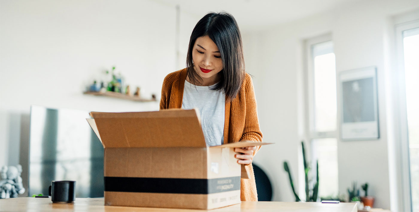 woman unpacking amazon parcel